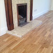 Light Oak Engineered Wood Flooring Fully Fitted to a Lounge, Hall and WC. 
