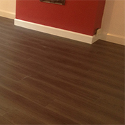 Dark Wood Luxury Vinyl Tiles Ply-boarded and Fully Fitted To a Living Room